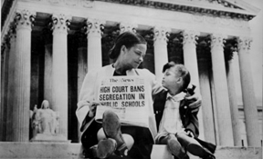 The U.S. Supreme Court bans segregation in public schools
