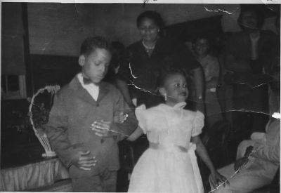 Tom Thumb Wedding 1952 #1
The Tom Thumb Wedding at Little Washington Graded School- 1952. Julia Boddie and Andy Carter; Fay J. Nicholas in background.
